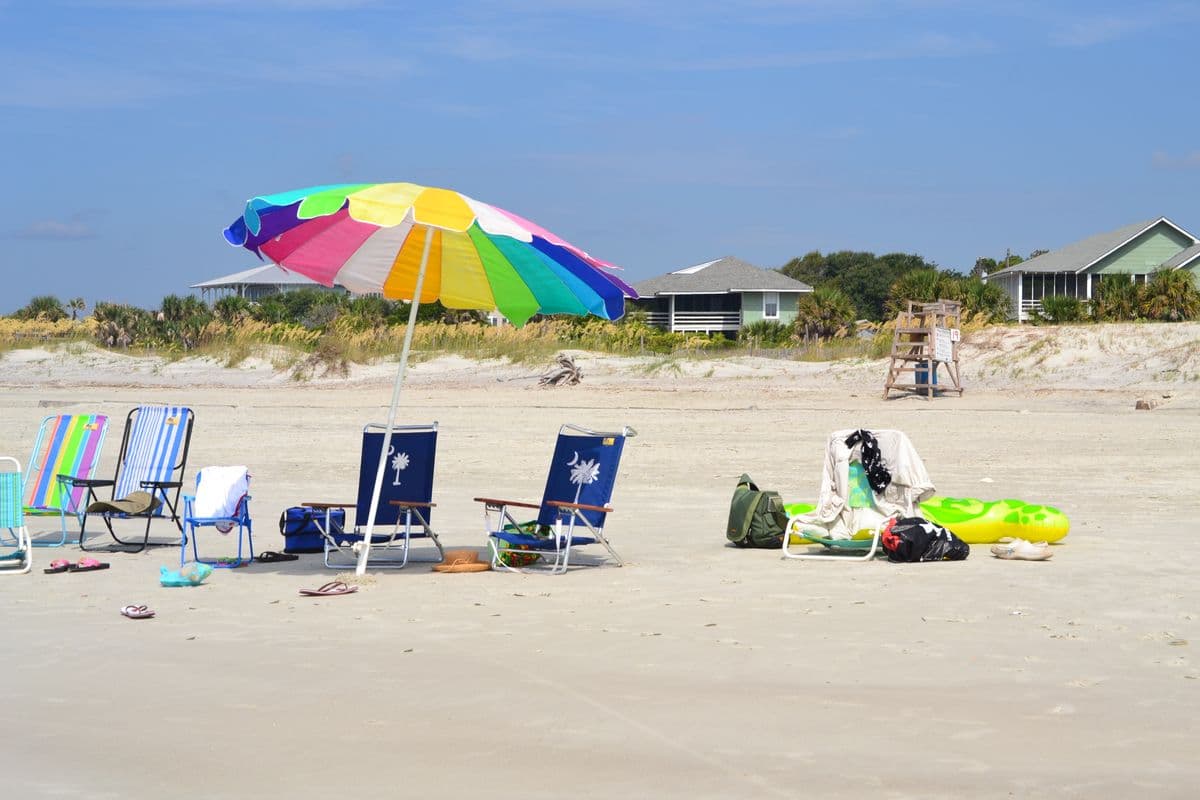 Beach chairs and a shade umbrella on the sand