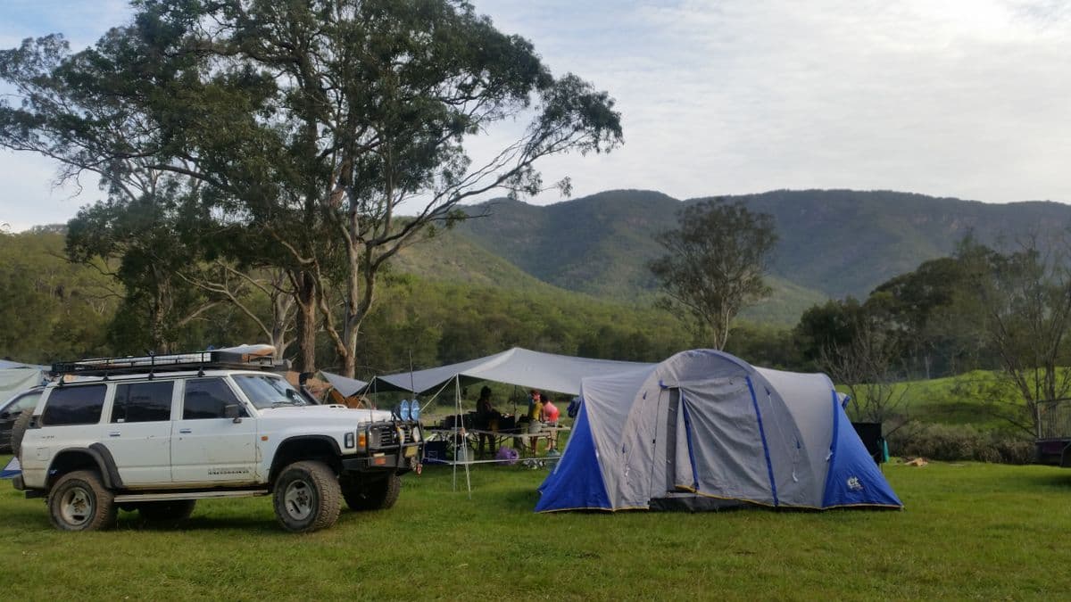 Camping gear laid out at a campsite in nature